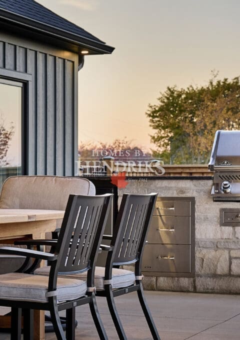 A well-designed outdoor BBQ area featuring a built-in grill and spacious countertop, perfect for cooking and entertaining.