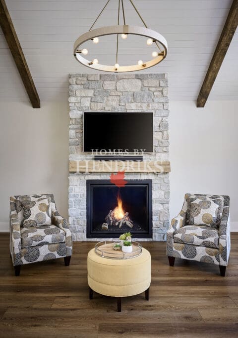 A striking stone fireplace serving as the focal point of the living area, featuring natural stone masonry that adds rustic elegance and earthy charm.